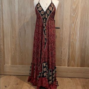 Long silky halter dress with leaves print.